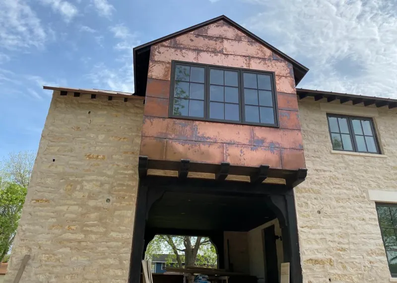 Copper metal panel facade on a stone building for Skylight Installation in Shaker Heights